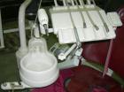 Used PROMA/ ADEC dental chair (red) with unattached light, attached sink and attached tray.