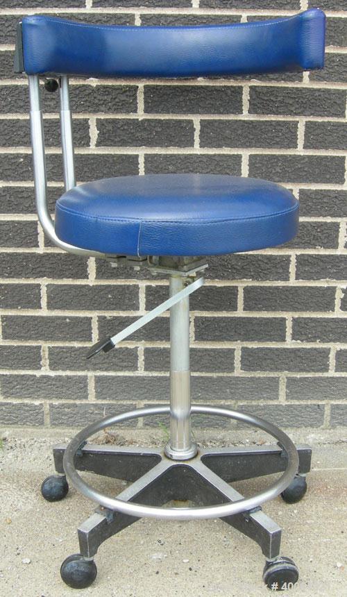 Used Dentsply blue assistant stool.  Mounted on casters.
