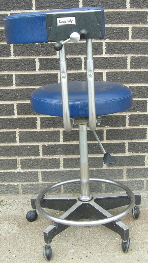 Used Dentsply blue assistant stool.  Mounted on casters.