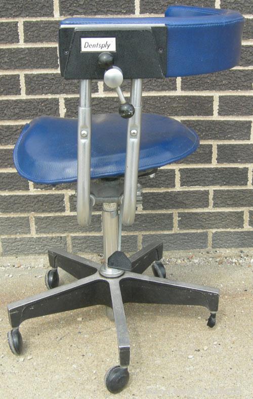 Used Dentsply blue assistant stool.  Mounted on casters.