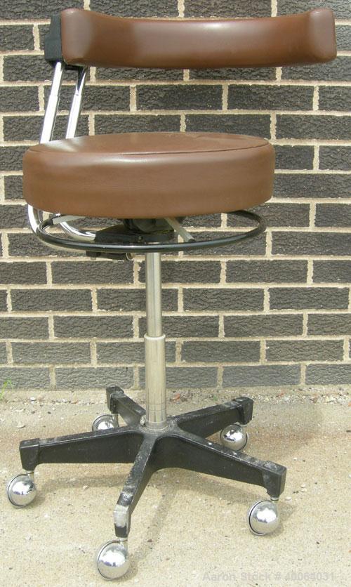 Used Dentsply Classic assistant stool with manually adjustable arm rest.