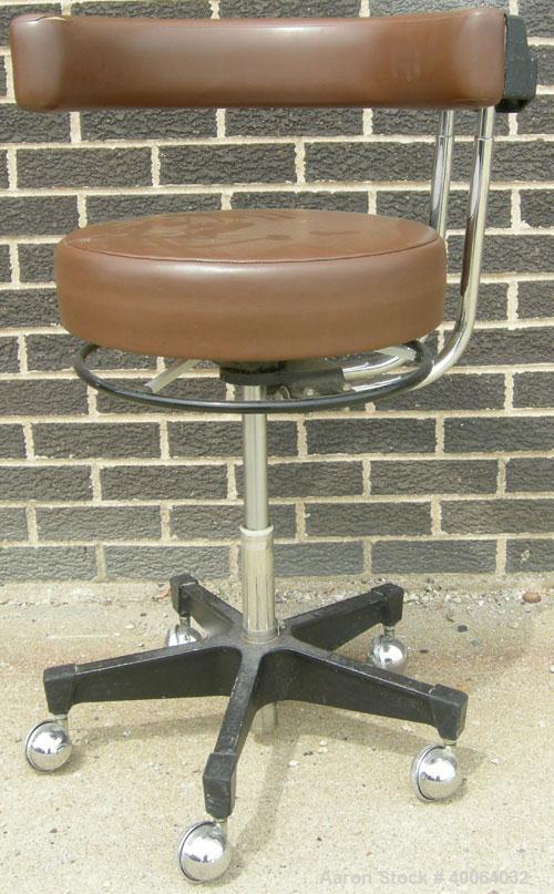 Used Dentsply Classic assistant stool with manually adjustable arm rest.