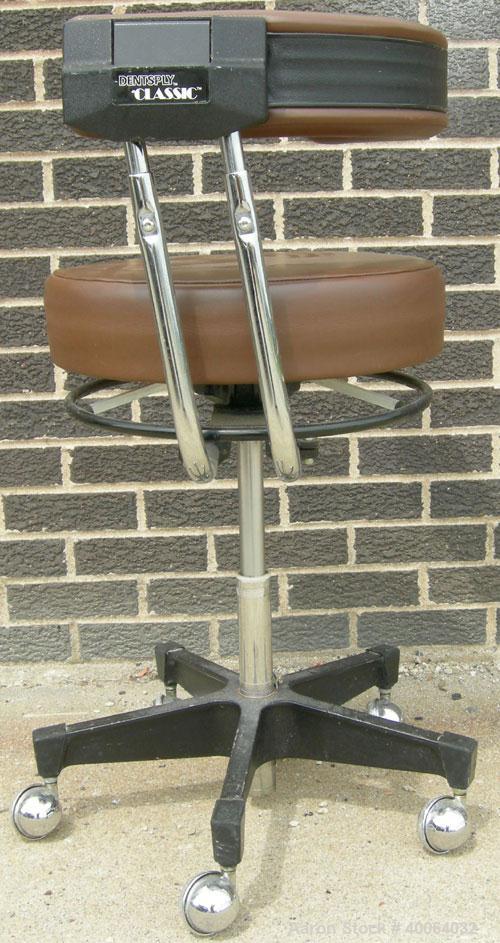 Used Dentsply Classic assistant stool with manually adjustable arm rest.