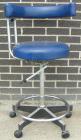 Used Dentsply blue assistant stool.  Mounted on casters.