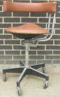 Used Dentsply tan assistant stool.  Mounted on casters.