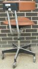 Used Dentsply tan assistant stool.  Mounted on casters.