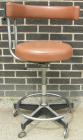 Used Dentsply tan assistant stool.  Mounted on casters.