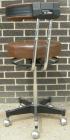 Used Dentsply Classic assistant stool with manually adjustable arm rest.