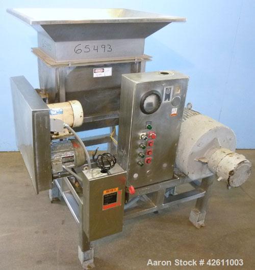 Used Urschel Model 2100 Comitrol Slicer. Urcshel 66755 3K030240U stainless steel cutting head. 30'' Deep stainless steel hopper with 22'' x 30'' infeed opening. Blunt blade horizontal agitator and st...