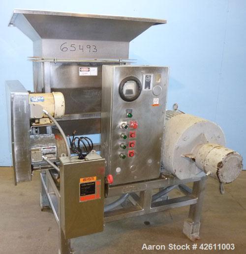 Used Urschel Model 2100 Comitrol Slicer. Urcshel 66755 3K030240U stainless steel cutting head. 30'' Deep stainless steel hopper with 22'' x 30'' infeed opening. Blunt blade horizontal agitator and st...