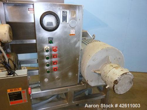 Used Urschel Model 2100 Comitrol Slicer. Urcshel 66755 3K030240U stainless steel cutting head. 30'' Deep stainless steel hopper with 22'' x 30'' infeed opening. Blunt blade horizontal agitator and st...