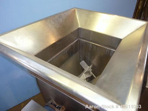Used Urschel Model 2100 Comitrol Slicer. Urcshel 66755 3K030240U stainless steel cutting head. 30'' Deep stainless steel hopper with 22'' x 30'' infeed opening. Blunt blade horizontal agitator and st...