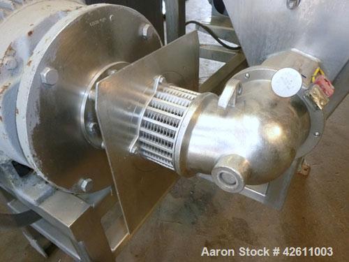 Used Urschel Model 2100 Comitrol Slicer. Urcshel 66755 3K030240U stainless steel cutting head. 30'' Deep stainless steel hopper with 22'' x 30'' infeed opening. Blunt blade horizontal agitator and st...