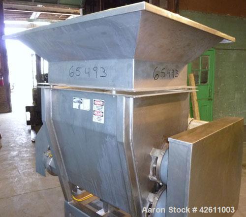 Used Urschel Model 2100 Comitrol Slicer. Urcshel 66755 3K030240U stainless steel cutting head. 30'' Deep stainless steel hopper with 22'' x 30'' infeed opening. Blunt blade horizontal agitator and st...