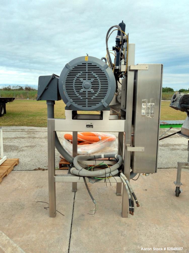 Used Urschel Comitrol Processor, Model 9300. Equipped with 12" microcut head and impeller. Approximate 200hp motor. Maximum product infeed 3/8" (9.5mm) to a slurry depending on microcut head used. Ap...