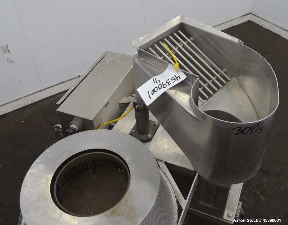 Used Urschel Slicer, Model CC, Stainless Steel. Maximum input product size 3-1/2". Unit consists of (1) swing away feed hopper, upper, and lower discharge chute, bearing housing, and cutting head sup...