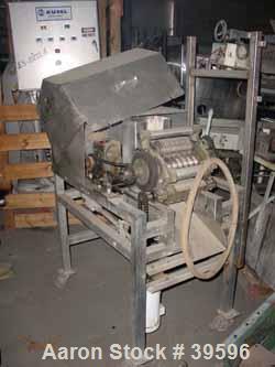 Used Urschel Slicer/Dicer, Model L, Stainless Steel. Approximately (2) 8" wide rotors, driven by a 1/2 hp gearmotor. Capacity 3000 pounds per hour. 6-1/2" x 6-3/4" feed chute, discharge roll, approxi...