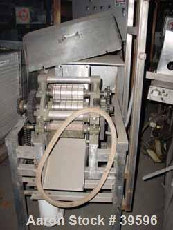 Used- Urschel Slicer/Dicer, Model L, Stainless Steel. Approximately (2) 8" wide rotors, driven by a 1/2 hp gearmotor. Capaci...