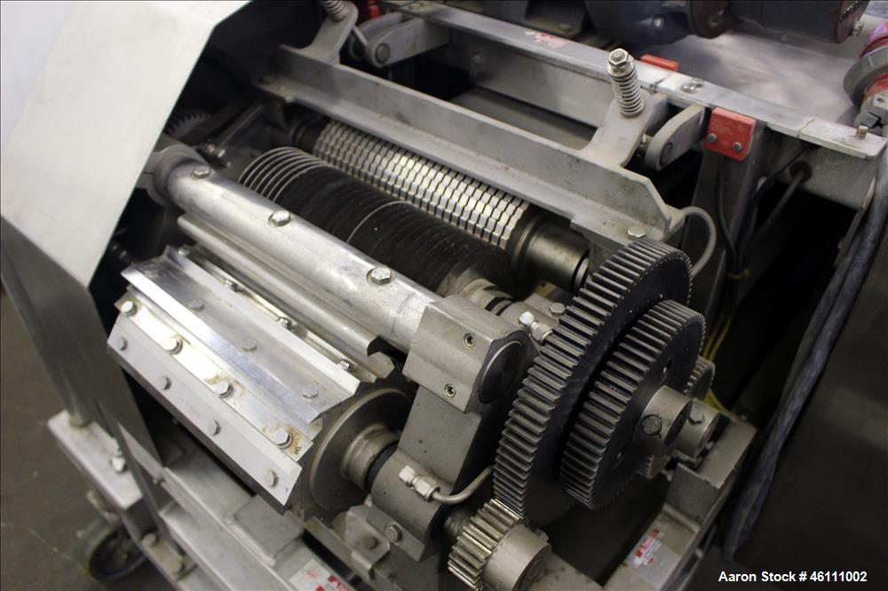 Used Urschel Dicer, Strip Cutter, and Shredder, Model M, 304 Stainless Steel. Will produce square or rectangular dices from 1/8" x 3/16" to 1-1/2" x 3", maximum thickness 1". Belt feed approximately ...