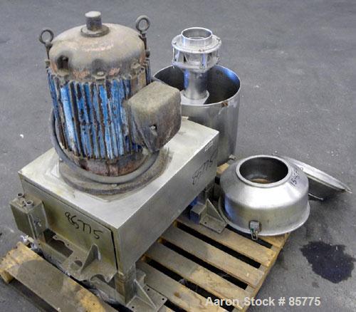 Used Urschel Comitrol Processor, Model MG1700, 15-5 PH Stainless Steel. Approximate 6" diameter impeller, microcut cutting head. Top feed with hopper, bottom discharge hopper. Driven by an approximat...