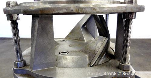 Used Urschel Comitrol Processor, Model MG1700, 15-5 PH Stainless Steel. Approximate 6" diameter impeller, microcut cutting head. Top feed with hopper, bottom discharge hopper. Driven by an approximat...