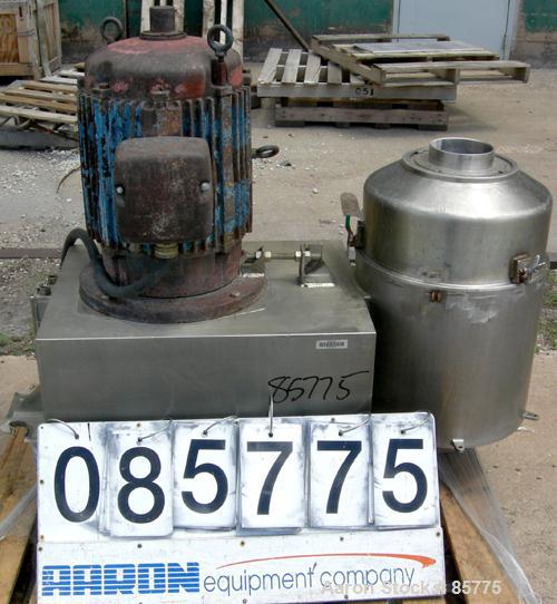 Used Urschel Comitrol Processor, Model MG1700, 15-5 PH Stainless Steel. Approximate 6" diameter impeller, microcut cutting head. Top feed with hopper, bottom discharge hopper. Driven by an approximat...