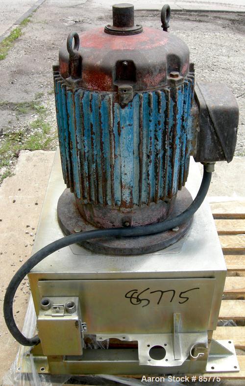 Used Urschel Comitrol Processor, Model MG1700, 15-5 PH Stainless Steel. Approximate 6" diameter impeller, microcut cutting head. Top feed with hopper, bottom discharge hopper. Driven by an approximat...