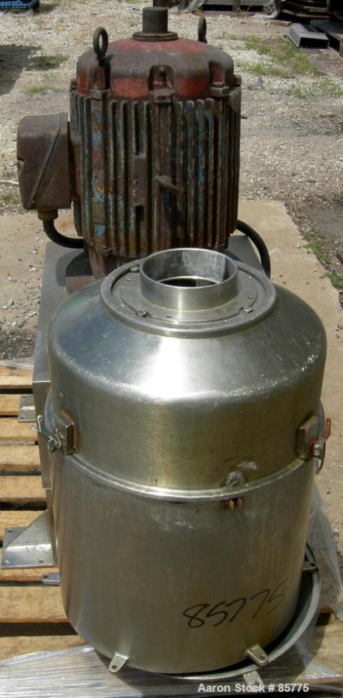 Used Urschel Comitrol Processor, Model MG1700, 15-5 PH Stainless Steel. Approximate 6" diameter impeller, microcut cutting head. Top feed with hopper, bottom discharge hopper. Driven by an approximat...