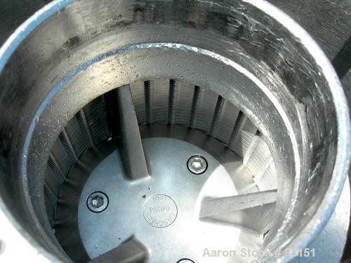 Used Urschel Comitrol Processor, Model MG, 304 stainless steel. Approximately 6" diameter x 3" deep cutting head. 3 blade impeller. Driven by a 20 hp, 3/60/208-220/440 volt, 3530 rpm motor. 5" diamet...