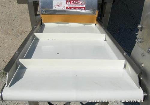 Used Urschel Dicer, Model M, 304 stainless steel. Designed for dicing or strip cutting food products. 11" wide x 60" long infeed conveyor, (1) feed roll, (17) 4 1/2" diameter circular knives, feed dr...