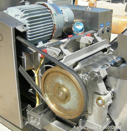 Used Urschel Dicer, Model M, 304 stainless steel. Designed for dicing or strip cutting food products. 11" wide x 60" long infeed conveyor, (1) feed roll, (17) 4 1/2" diameter circular knives, feed dr...