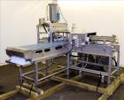 Used Marchant Schmidt Pneumatic Cheese Cubing Machine, Model MS80. Machine is rated at speeds up to 10,000 pounds per hour. Handles (2) 40 pound blocks of cheese, 2 blocks per cycle. Designed for har...