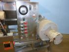 Used Urschel Model 2100 Comitrol Slicer. Urcshel 66755 3K030240U stainless steel cutting head. 30'' Deep stainless steel hopper with 22'' x 30'' infeed opening. Blunt blade horizontal agitator and st...