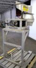 Used Urschel Slicer, Model CC, Stainless Steel. Maximum input product size 3-1/2”. Unit consists of: Swing away feed hopper, upper, and lower discharge chute, bearing housing, and cutting head suppor...