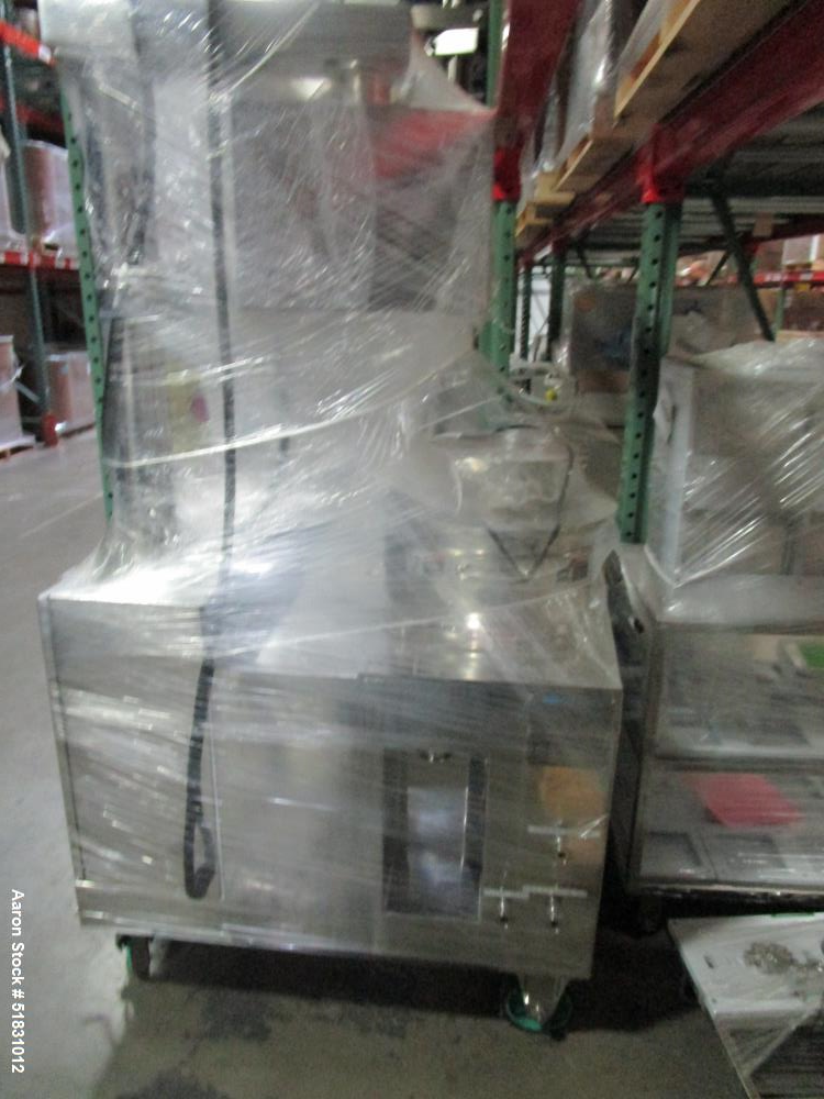 Used Fuji Paudal Marumerizer spheronizer, model QJ400TG, stainless steel construction, with 2.0 mm grooved spheronizing plate with plate lift mechanism, jacketed bowl, side discharge with pneumatical...
