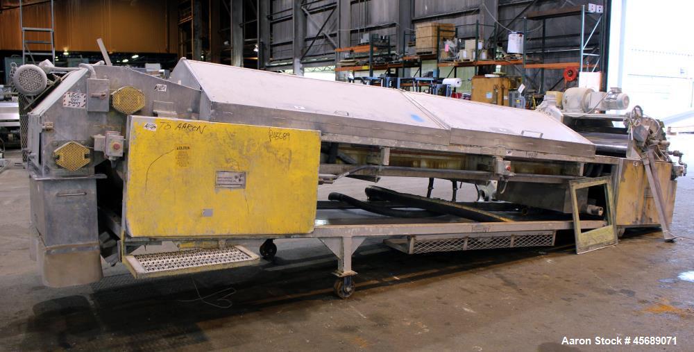 Used Buss Condux cooling belt. Approximate 39-3/8" wide x 210" long stainless steel belt, driven by a 2hp gear motor. (2) Approximate 40" wide x 12" diameter cored infeed rolls, driven by a 5hp motor.