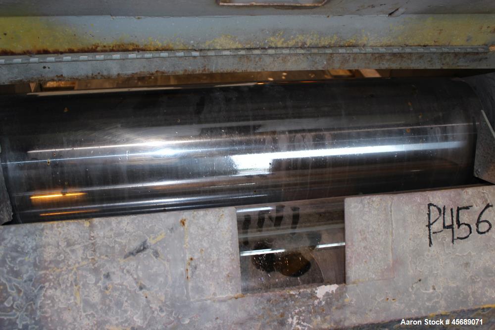 Used Buss Condux cooling belt. Approximate 39-3/8" wide x 210" long stainless steel belt, driven by a 2hp gear motor. (2) Approximate 40" wide x 12" diameter cored infeed rolls, driven by a 5hp motor.