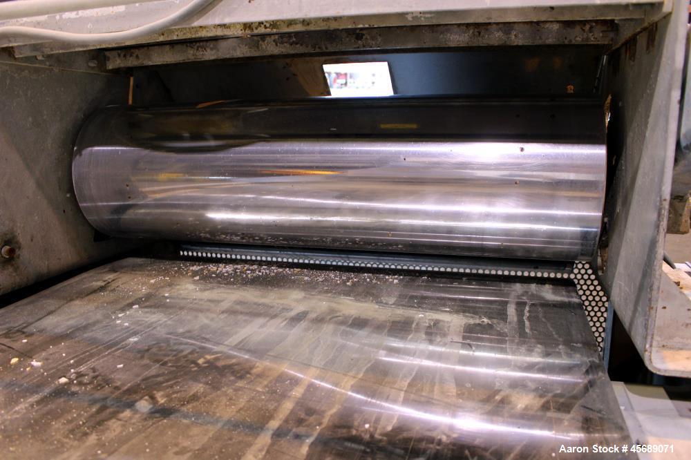 Used Buss Condux cooling belt. Approximate 39-3/8" wide x 210" long stainless steel belt, driven by a 2hp gear motor. (2) Approximate 40" wide x 12" diameter cored infeed rolls, driven by a 5hp motor.