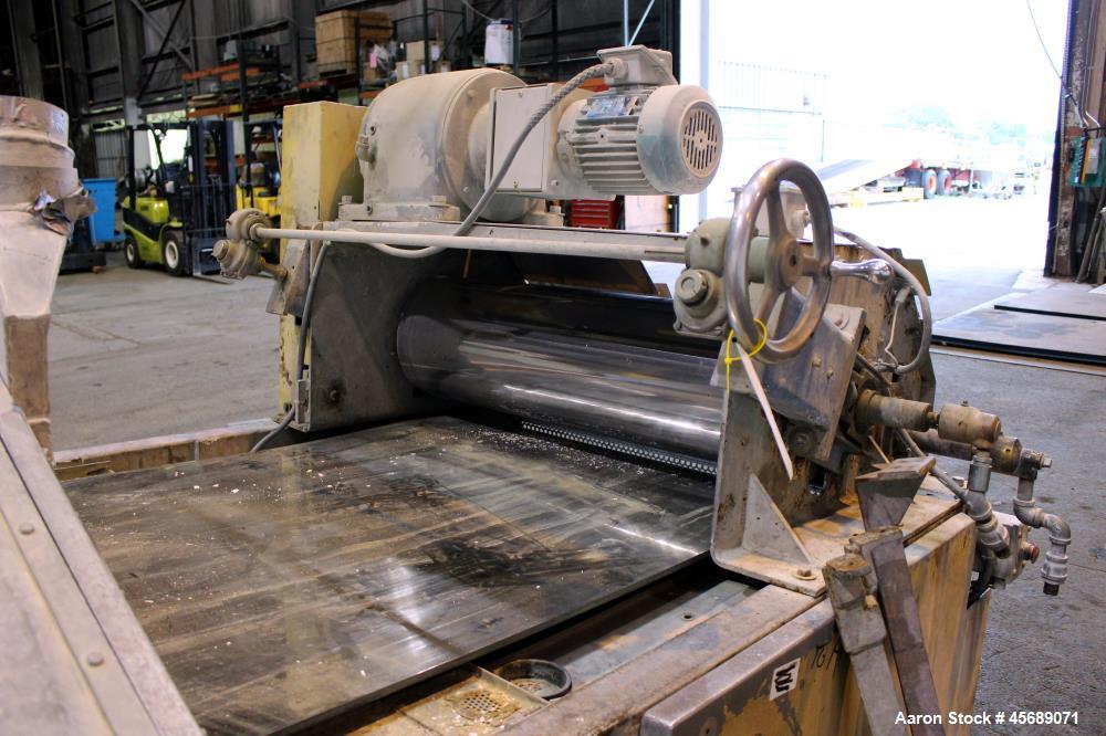 Used Buss Condux cooling belt. Approximate 39-3/8" wide x 210" long stainless steel belt, driven by a 2hp gear motor. (2) Approximate 40" wide x 12" diameter cored infeed rolls, driven by a 5hp motor.
