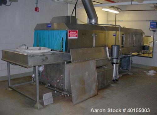 Used:  Ecolab continuous pan washer, model CD-906PW, stainless steel. Approx 51" wide x 15' long wash/dry area, 40" long infeed, 40" long outfeed table. Will wash 18" wide x 38" long x 2-1/2" deep pa...