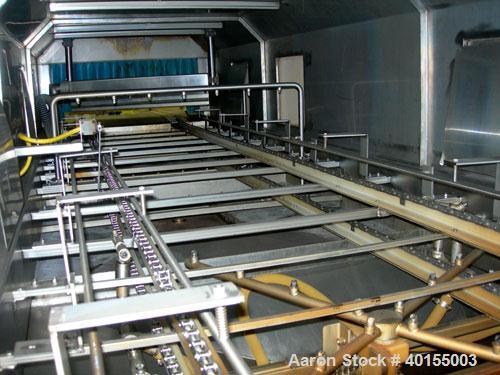 Used:  Ecolab continuous pan washer, model CD-906PW, stainless steel. Approx 51" wide x 15' long wash/dry area, 40" long infeed, 40" long outfeed table. Will wash 18" wide x 38" long x 2-1/2" deep pa...