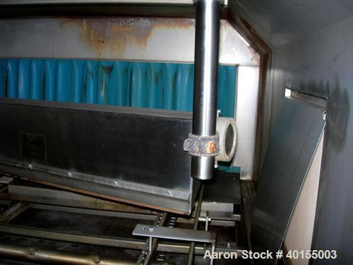 Used:  Ecolab continuous pan washer, model CD-906PW, stainless steel. Approx 51" wide x 15' long wash/dry area, 40" long infeed, 40" long outfeed table. Will wash 18" wide x 38" long x 2-1/2" deep pa...