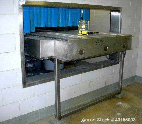 Used:  Ecolab continuous pan washer, model CD-906PW, stainless steel. Approx 51" wide x 15' long wash/dry area, 40" long infeed, 40" long outfeed table. Will wash 18" wide x 38" long x 2-1/2" deep pa...
