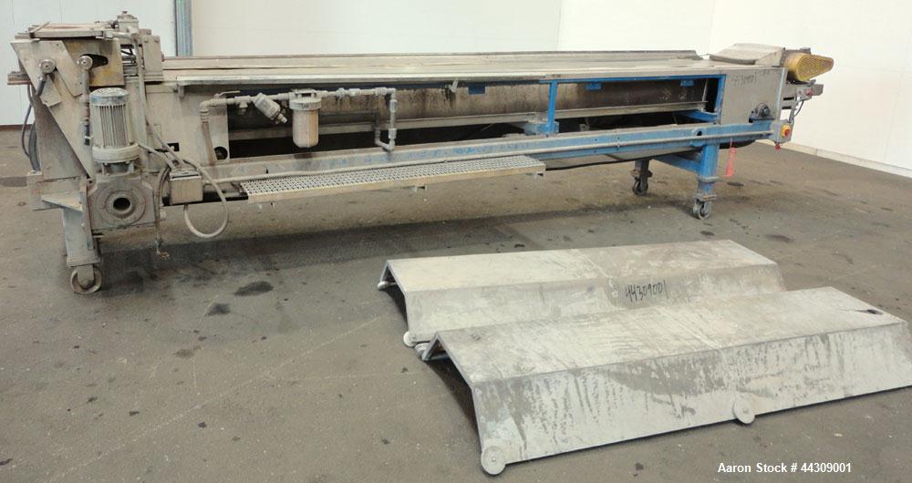 Used Spray Belt Cooler, 301 Stainless Steel. 19-1/2" Wide x 204" long belt. Driven by a 2 hp, 3/60/208-230/460 volt, 1725 rpm gear motor, ratio 10.0 to 1. (2) Cored feed roll assemblies, driven by an...