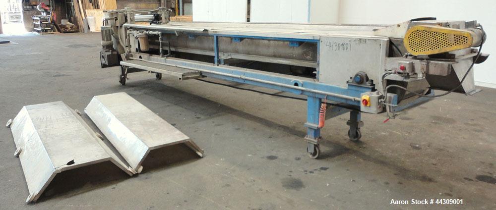 Used Spray Belt Cooler, 301 Stainless Steel. 19-1/2" Wide x 204" long belt. Driven by a 2 hp, 3/60/208-230/460 volt, 1725 rpm gear motor, ratio 10.0 to 1. (2) Cored feed roll assemblies, driven by an...