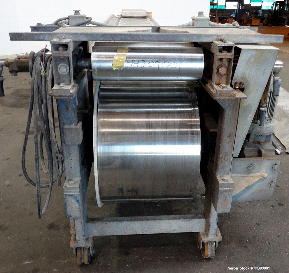 Used Spray Belt Cooler, 301 Stainless Steel. 19-1/2" Wide x 204" long belt. Driven by a 2 hp, 3/60/208-230/460 volt, 1725 rpm gear motor, ratio 10.0 to 1. (2) Cored feed roll assemblies, driven by an...