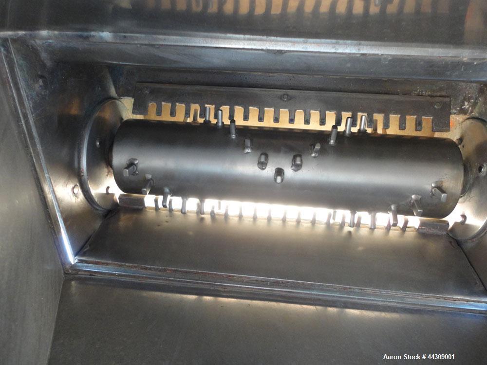 Used Spray Belt Cooler, 301 Stainless Steel. 19-1/2" Wide x 204" long belt. Driven by a 2 hp, 3/60/208-230/460 volt, 1725 rpm gear motor, ratio 10.0 to 1. (2) Cored feed roll assemblies, driven by an...