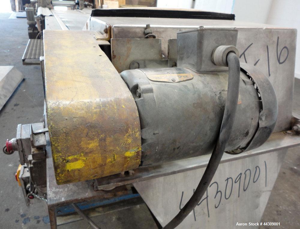 Used Spray Belt Cooler, 301 Stainless Steel. 19-1/2" Wide x 204" long belt. Driven by a 2 hp, 3/60/208-230/460 volt, 1725 rpm gear motor, ratio 10.0 to 1. (2) Cored feed roll assemblies, driven by an...