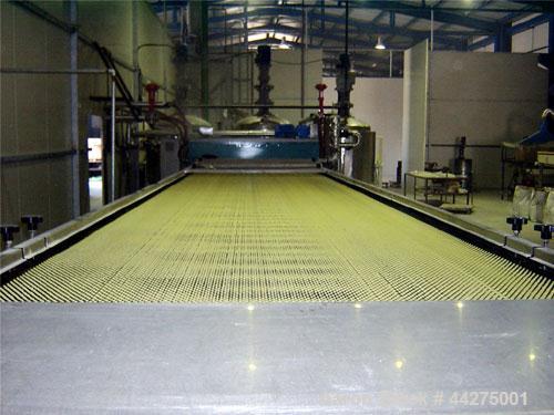 Used Rollomat Hot Melt Production Belt and Rotating Pastillator Applicator Head.  Rated for 500 - 600 kgrs/hour.  Belt is approximately 5' wide x 30' long.  Unit for hot melt glue, resins and rosins....