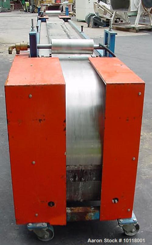 Used Sandvik Belt Cooler (Sandvik Process Systems) 12" x 16' long with polished stainless steel belt. Dual 12" wide x 4.5" diameter jacketed rolls are mounted above cooling belt at beginning and term...